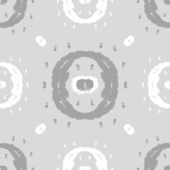 Vector seamless geometric monochrome pattern. Circles and spots in gray tones. Design for printing on textiles, packaging, paper, wallpaper.