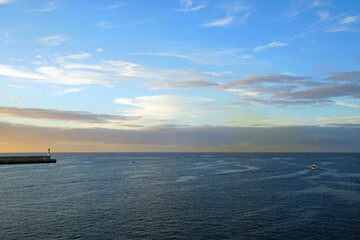 Fototapeta na wymiar The magic of the ocean. Sunrise over the Atlantic. Horizon and endless space. Beautiful view. Clouds
