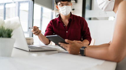 two smart colleague coworking collecting and analyzing demanding data