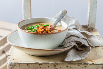 Homemade mushroom soup with parsley and cream. Creamy mushroom soup.