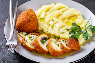 Chicken Kiev served with potato mash on a plate
