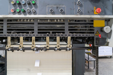 The offset press in the production process is in the printing factory