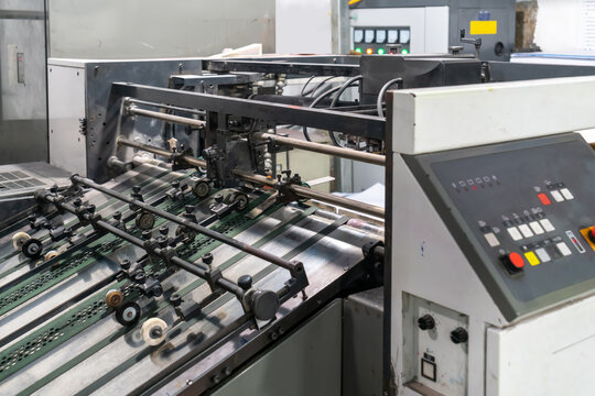 The offset press in the production process is in the printing factory