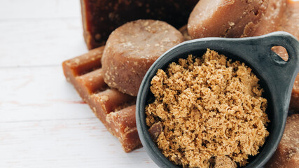 panela, from sugar cane, for different preparations on a white wooden base, made in Colombia.