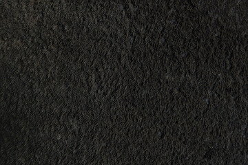 Weird black texture fibers from carpet or rug closeup. Artistic background
