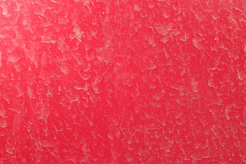 Water stains on red concrete painted wall. Textured pattern.