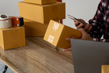 Start an Asian writing business working with parcel boxes at home with laptops to read orders and deliver products to customers. transport and logistics Online merchants and business owners or SMEs, o