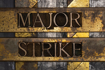 Major Strike text message on textured grunge copper and vintage gold background