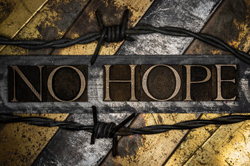 No Hope text on vintage grunge textured copper and gold background with barbed wire