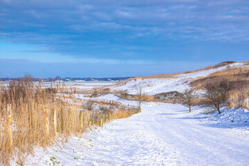 Snowy landscape with hills and meadows in Buytenpark Zoetermeer, the Netherlands