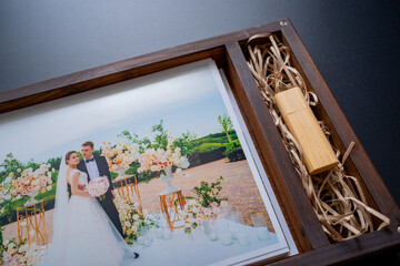 wedding photos and flash drive in box. beautiful return of result of photo shoot