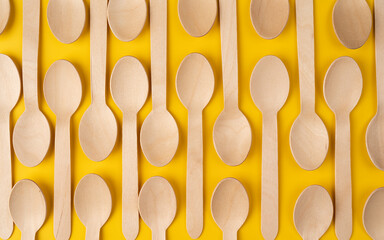 Wooden spoon put together as a pattern for background on top view