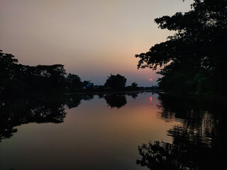 Fototapeta premium Awesome sun set in a winter after noon in a small river side in northern India.