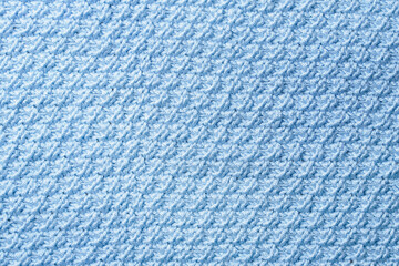Knit texture of blue wool knitted fabric with pattern background.