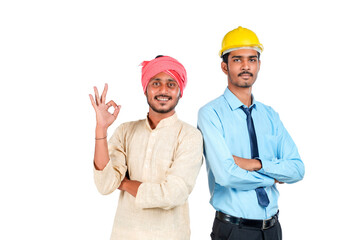 Young indian engineer with farmer on white background.