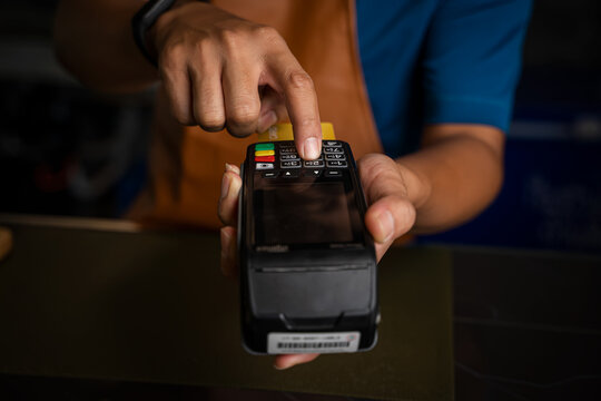 Payment over nfc technology,Customer making wireless or contactless payment using credit card,Buy and sell products & service.