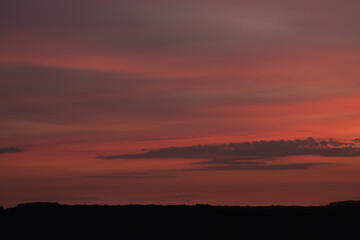 Sunset clouds in the sky in summer evening