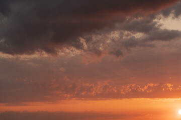 Obraz premium Sunset clouds in the sky in summer evening