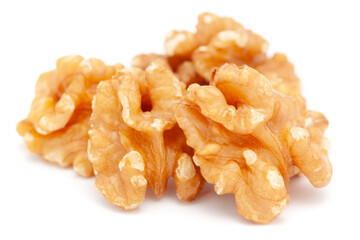 Micro close-up and details of Organic brown Cracked walnut (Juglans cinerea) cores (kernel)  isolated over white background.