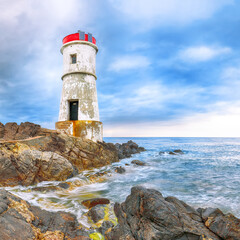 Fototapeta na wymiar Gorgeous gloomy view of Capo Ferro Lighthouse.