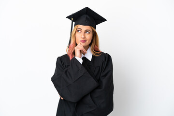 Young university graduate over isolated white background having doubts while looking up