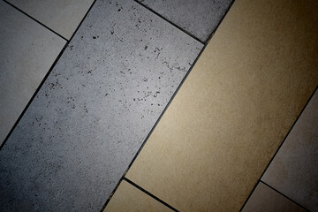 Beige and white tile floor background texture close up with vignettes
