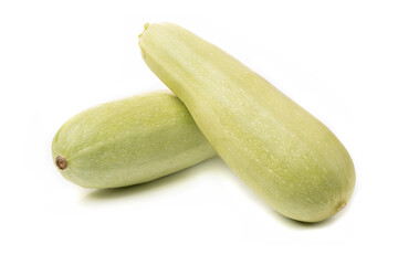 Fresh white zucchini with sliced pieces on a white background.