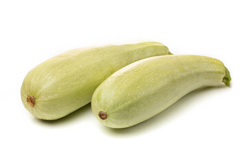 Fresh white zucchini with sliced pieces on a white background.