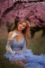 Woman in the flower garden. vintage photo with white flowers in spring