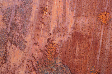 Rust on painted metal when exposed to the environment.