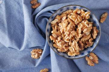 walnut on a plate on table , close up.