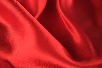 Obraz premium abstract texture of draped red velvet background. eautiful textile backdrop. Close-up. Top view