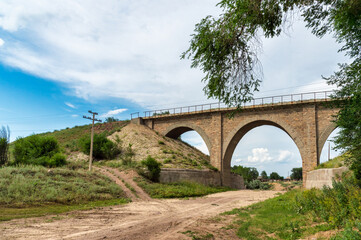 Fototapeta na wymiar Railway bridge over a dry valley