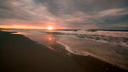 Fototapeta na wymiar Atlantic Ocean sunrise over the beach