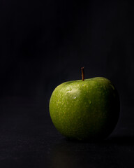 green apple on black