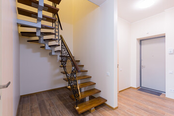 wooden stairs in the corridor of the apartment interior