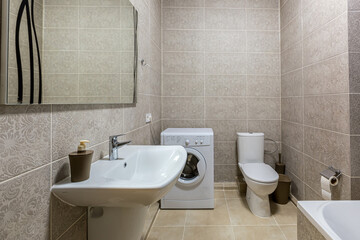 bathroom with shower, bathtub and light tiles