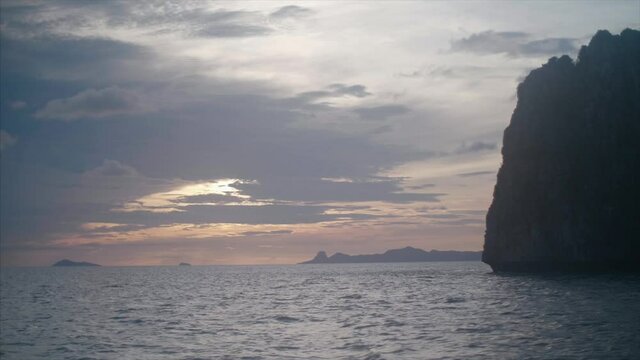 POV from a boat sailing through islands in South East Asia. 