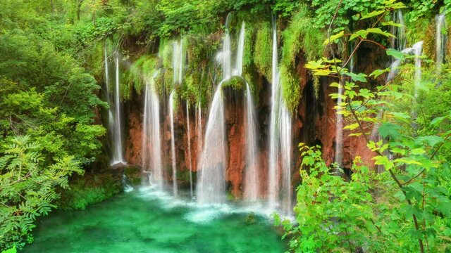 Cinemagraph video of waterfall landscape in Plitvice Lakes Croatia in springtime . Tranquil nature scenery for relaxation background .