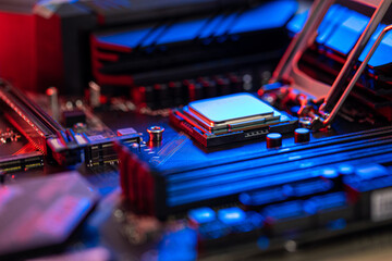 manipulating and installing processor on the motherboard in details with blur and selective focus