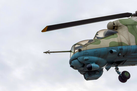 Russia, Lyubertsy - August 15, 2021: Close-up view of large attack helicopter Mi-24 (NATO reporting name: Hind). Overcast sky in the background. Military industry theme. Illustrative editorial.