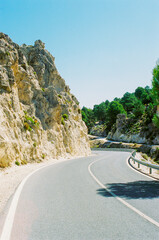 A road in the middle of dry Spain. Hot day traveling in the mountain.
