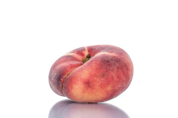 One juicy organic peach, close-up, isolated on white.