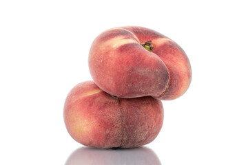 Fototapeta na wymiar Two juicy organic peaches, close-up, isolated on white.