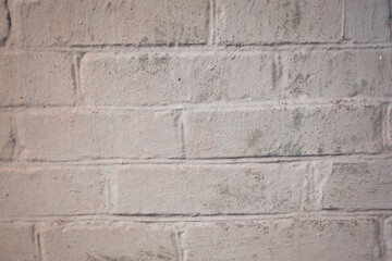 texture of old brickwork painted with gray paint. Weathered background. background consisting of horizontal part of gray painted brick wall.