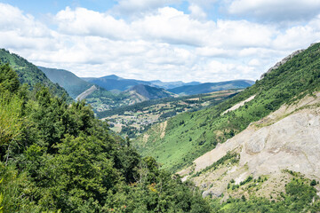 Fototapeta na wymiar Scenic landscape of Asturias, mountains with a village at the bottom of a valley.