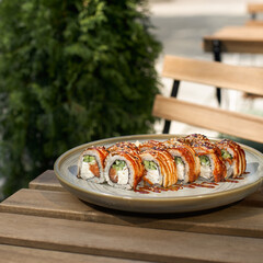 Baked sushi roll Canada with salmon, cream cheese.