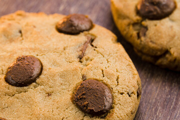Chocolate cookies on wooden table. Close-up Macro. Selective focus.