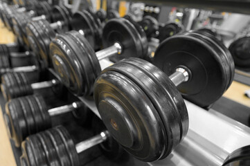 Close up of dumbbells. Gym interior. High quality photo