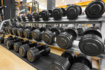 Close up of dumbbells. Gym interior. High quality photo